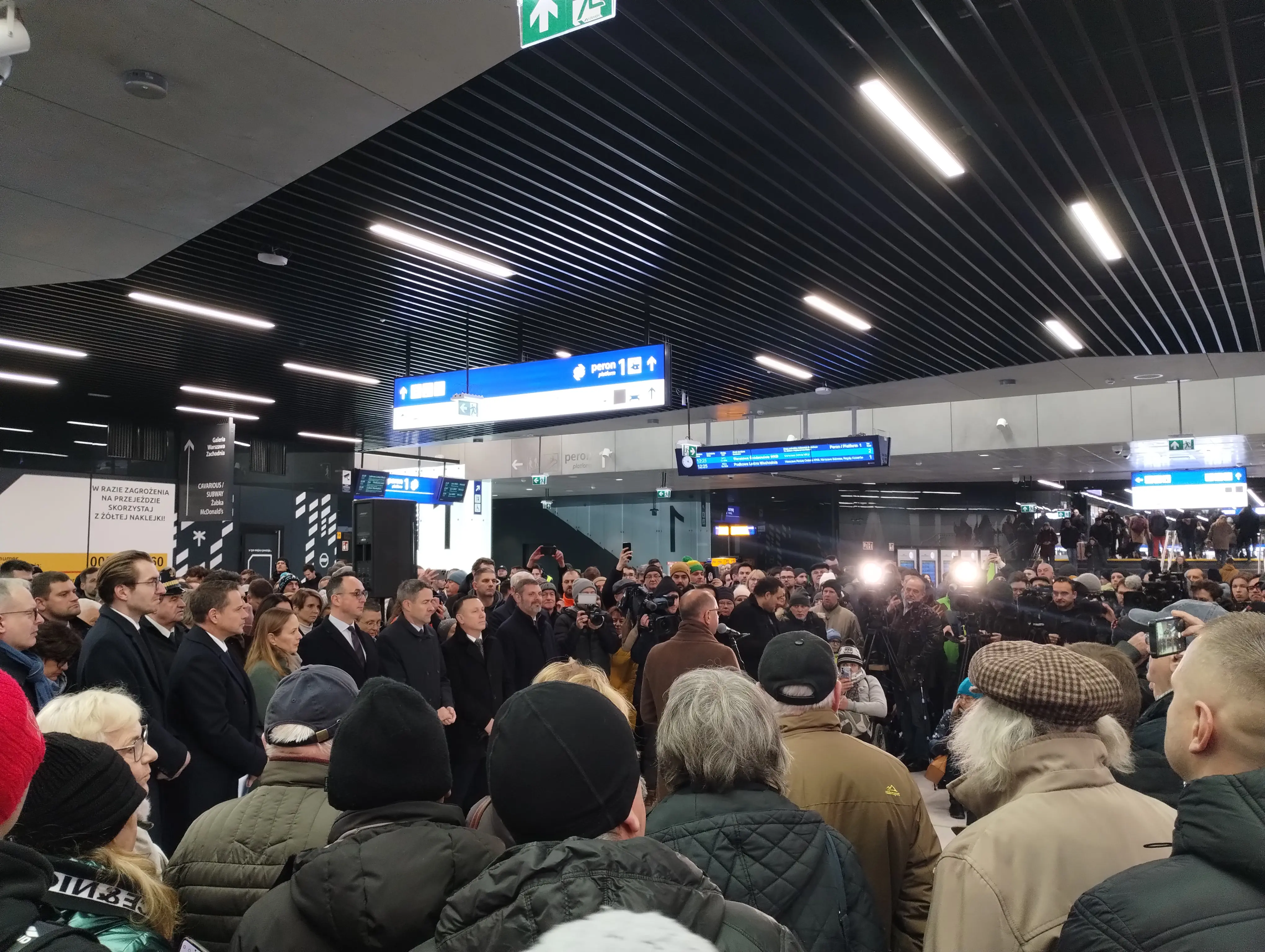 Crowd of people including politicians gathered on an opening ceremony of the new tunnel
