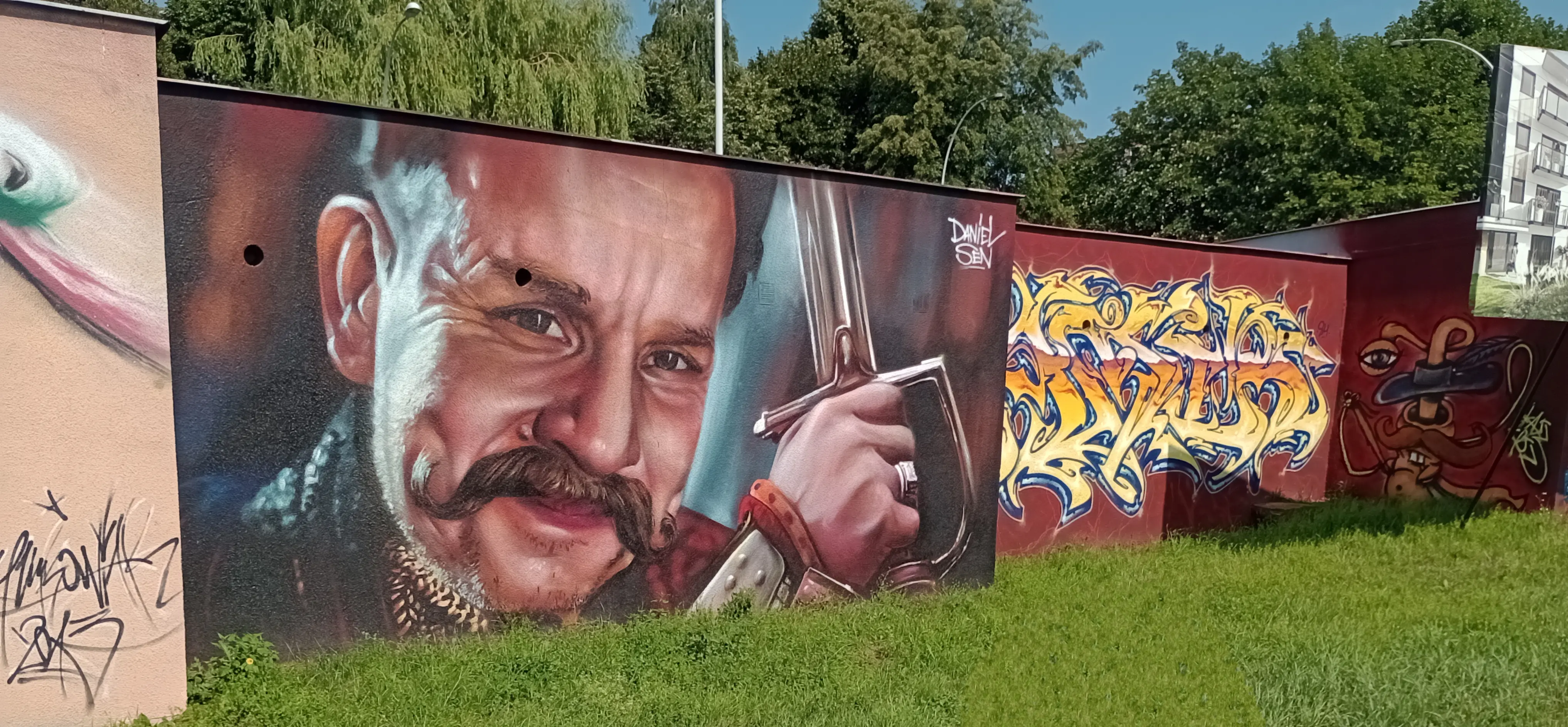 street art on garage building depicting Jan Paweł from 1670 Polish Netflix series