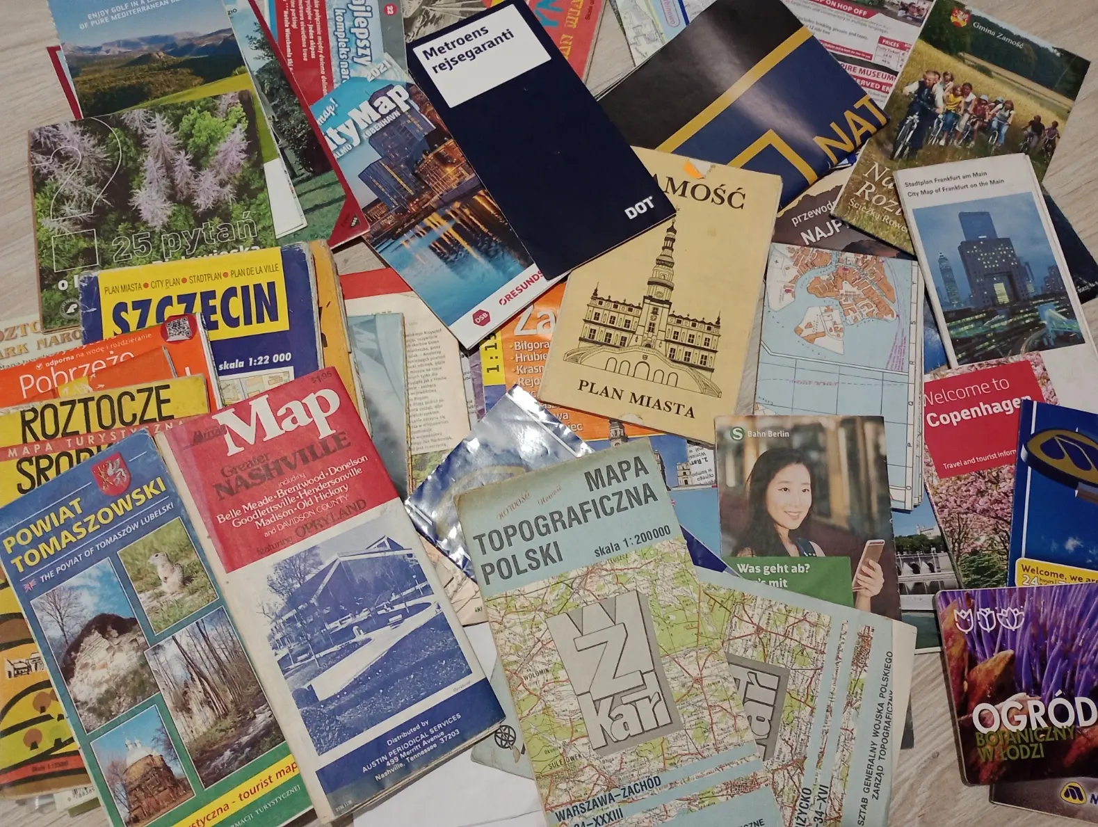 random paper maps scattered around